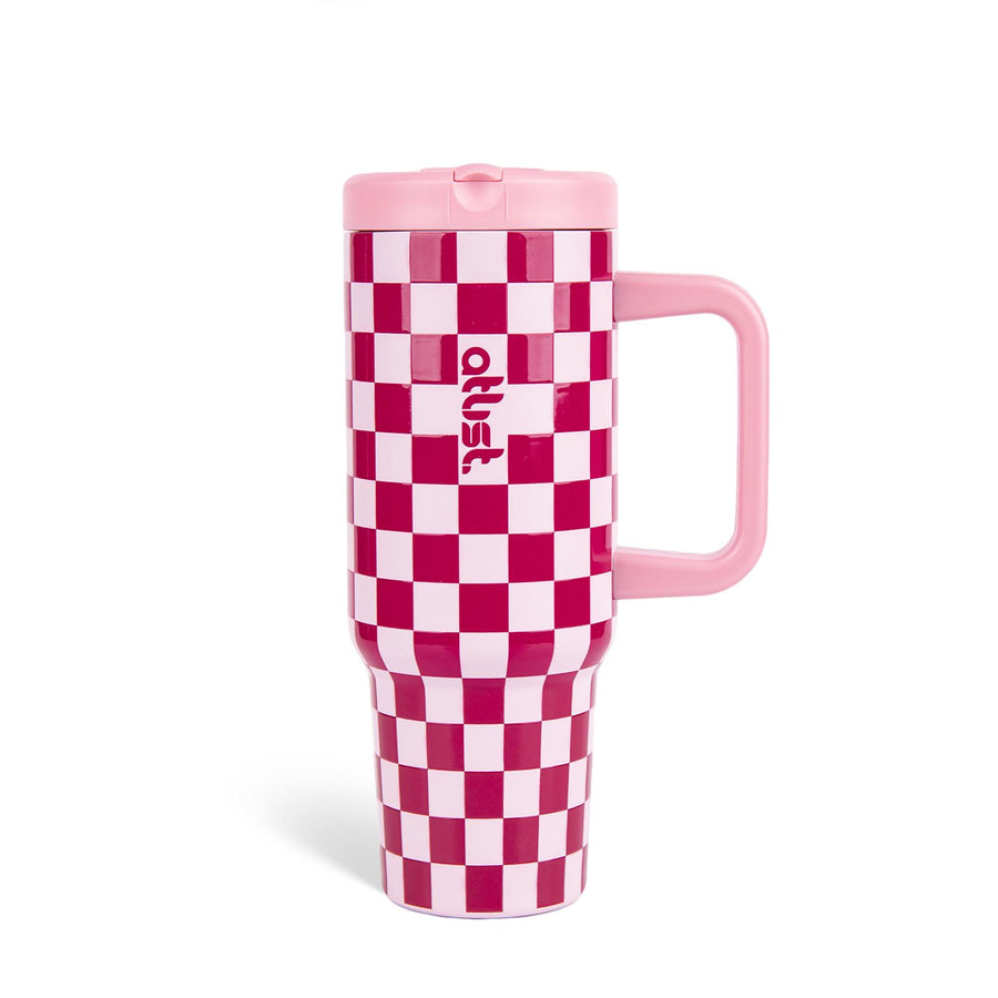 Pink and burgundy checkered 40oz Atlist tumbler with straw and handle on a white background